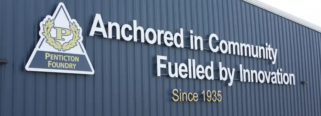 An image of a wall with Penticton Foundry's slogan Fueled by Innovation, along with a core value Anchored in Community.